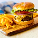 smash burger recipe blackstone with cheese, lettuce, tomato.